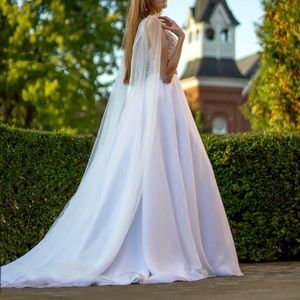 Floor length bridal shoulder vail in ivory.
